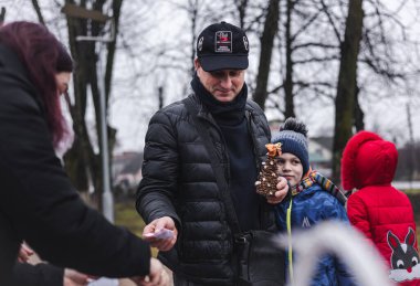 Hrebinky, Ukraine, January 19 2023, charity fair in support of the armed forces, children collect aid.