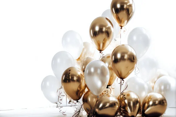 Gold and white balloon on white background with copy space.