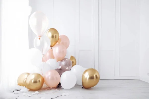 Pink gold and white balloon on white background with copy space.