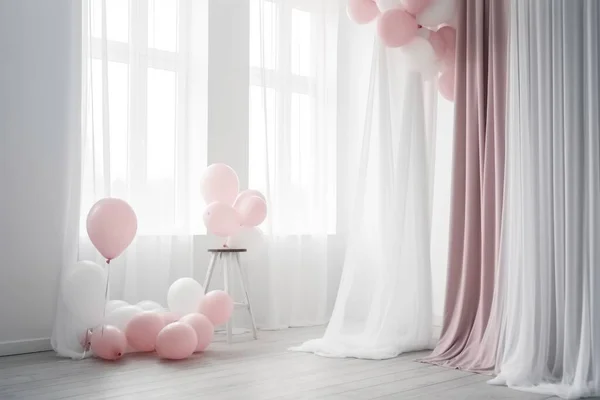 Pink and white balloon on white  room with curtain background
