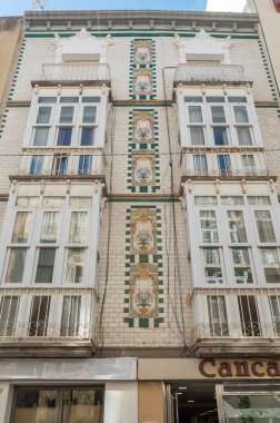 Cartagena, Spain : 2022 November 23 : Buildings in the tourist city of Cartagena with moored boats in the autumn of 2022.