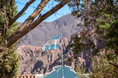 Flag of Argentina flying in the city of Tilcara in the province of Jujuy in Argentina. clipart