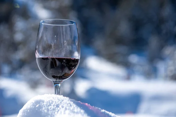 Glass of Red Wine in the mountains on a sunny day.