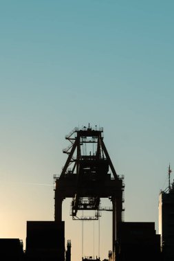 Barcelona, Spain : 2024 May 12 : Cargo Cranes at dusk in the port of Barcelona in 2024. clipart