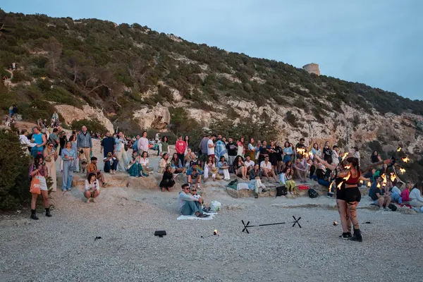 stock image Es Vedra, Ibiza, Spain: 2024 May 14: People enjoying the sunset at the Es Vedra viewpoint in Ibiza in summer 2024.