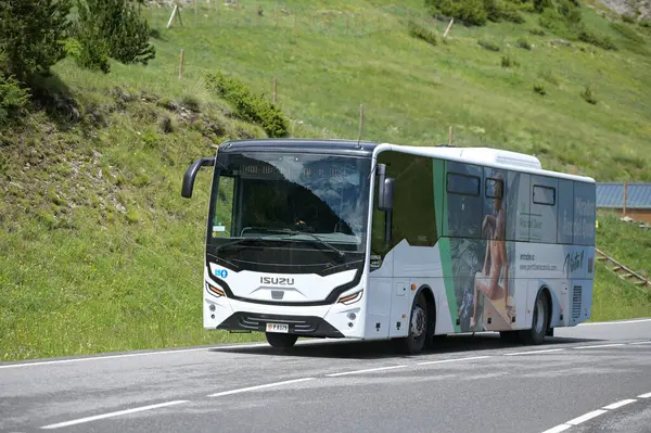 stock image Canillo, Andorra: June 28, 2024: Bus that directs people towards the Roc del Quer and the Tibetan Bridge of Canillo circulating on the roads of Andorra in summer 2024.