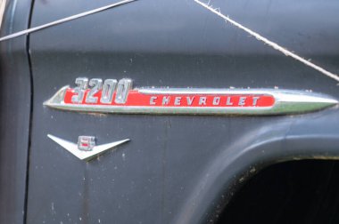 Canillo, Andorra - July 13, 2024: Classic 1957 Chevrolet 3200 logo of a classic 1957 Chevrolet Task Force 3200 pickup truck in Andorra in 2024. clipart