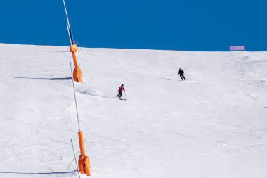 Grandvalira, Andorra: 2025 January 1: Skiers on the ski slopes in Andorra at Grandvalira in January 2025. clipart