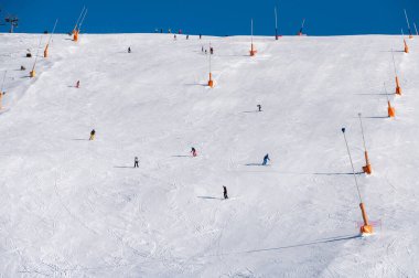 Grandvalira, Andorra: 2025 January 1: Skiers on the ski slopes in Andorra at Grandvalira in January 2025. clipart