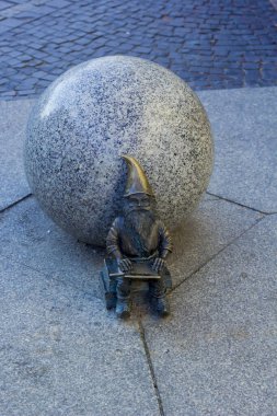 steel dwarf on the floor in wroclaw , poland