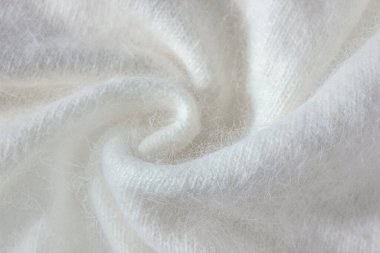 Beyaz alpaka kumaş girdabı ve yün yün süveter dokusu