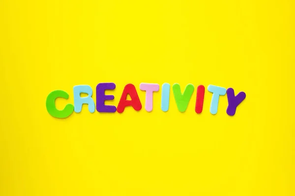 Creativity Word Colored Alphabet Letters Isolated Yellow Background Banner Headline — Stock Photo, Image