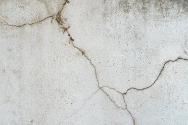 Çatlak alçı ve kirli grunge desenli yüzeyle kaplı eski beton duvar. Yüksek kalite fotoğraf