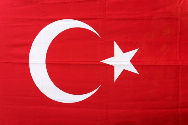 Turkish flag background. Red textile flag of Turkey on the streets of Istanbul on the holidays of patriotism and independence of the republic. Culture, nation, state. High quality photo