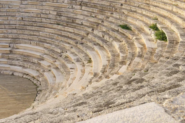 Ancient antique amphitheater in Turkey. The ancient Greek architecture of cities and buildings is the culture of the development of civilization. History, science, antiquity concept. High quality