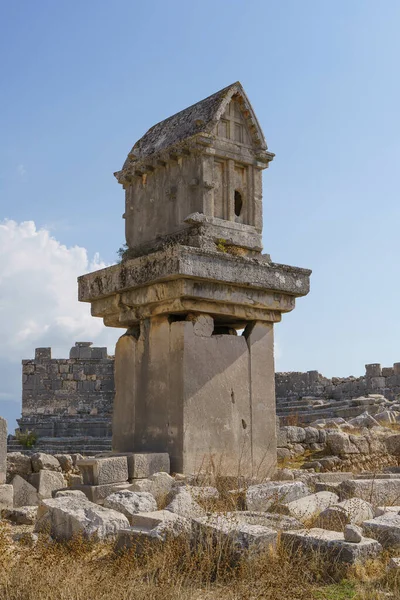 Ancient Greek stone tomb in the ancient city of Xanthos in Turkey. Ruins of ancient Greek civilization, stone objects of culture and art. High quality photo