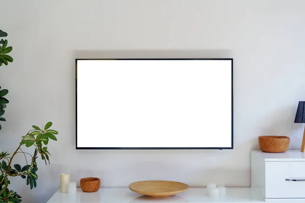TV led mock up screen. Smart TV on a wall in an empty white interior living room. High quality photo