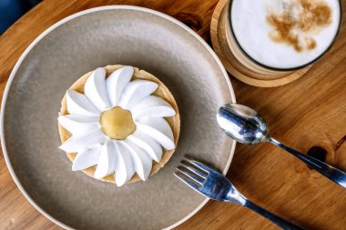 Coffee and cake on a cafe table outside. Morning, drink, good mood concept. High quality photo