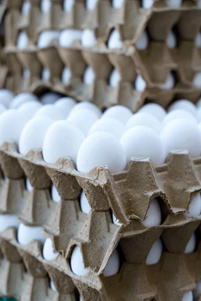 Eggs in a tray. Lots of chicken eggs at the farmers eco market. High quality photo