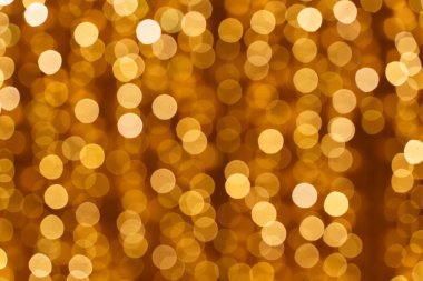  Altın bokeh arka planı. Doku folyosu ve konfeti bokeh, altın tozunun ışığı. Yılbaşı partisi ve yeni yıl arifesi geçmişi. Yüksek kalite fotoğraf