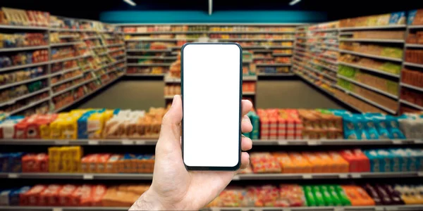 Sklep Spożywczy Online Telefon Ręką Tle Supermarketu Zakupami Wysokiej Jakości — Zdjęcie stockowe