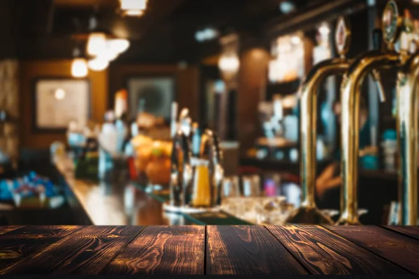 Pub bar counter with wooden table background. High quality photo