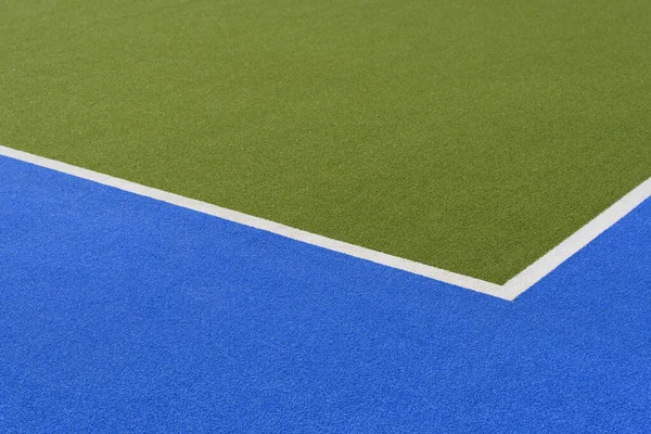 Sports court banner background. Colored artificial turf court in the stadium. High quality photo