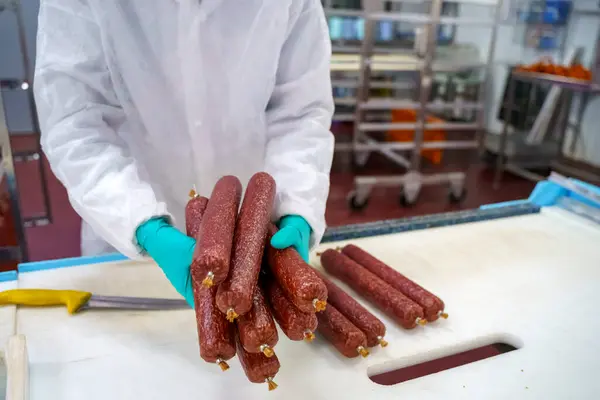 Salami sausage production at a meat factory. Pork and beef sausage salami industry. High quality photo