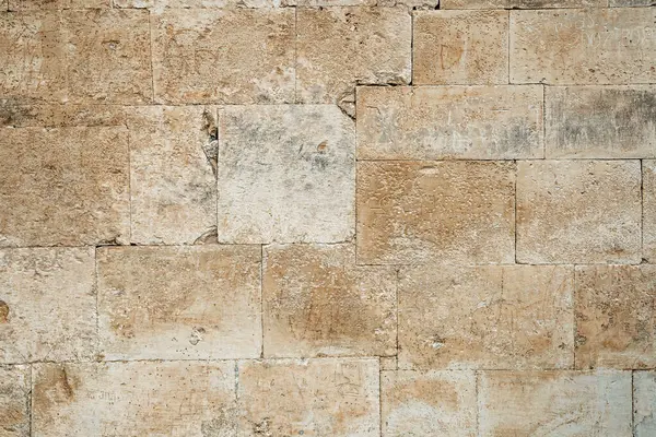 Antik taş duvar ustalığı arka planı. Bej taş bloklardan yapılmış eski duvar. Yüksek kalite fotoğraf