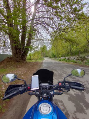 Kashmir, India - April 19 2021 : motorcycle rider in kashmir valley of himalayas.