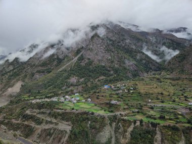 Lahaul and Spiti, Himachal Pradesh, India - 12 September 2021 : Village in Mountains covered by clouds.