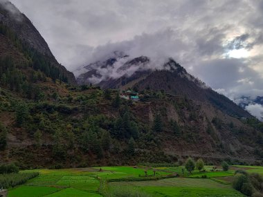 Lahaul and Spiti, Himachal Pradesh, India - 12 September 2021 : Village in Mountains covered by clouds.