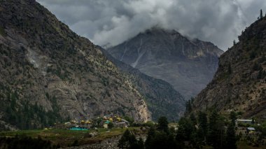Lahaul and Spiti, Himachal Pradesh, India - 12 September 2021 : Village in Mountains covered by clouds.