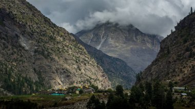 Lahaul and Spiti, Himachal Pradesh, India - 12 September 2021 : Village in Mountains covered by clouds.