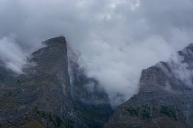 Lahaul and Spiti, Himachal Pradesh, India - 07 September 2021 : Himalayan landscape with peaks covered by clouds in mountains