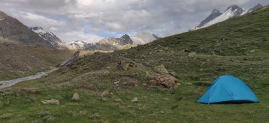 Himachal, India - July 10th, 2022 : wild camping in the Himalayas. camping tent among mountains of himalayas