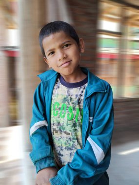 Himachal, India - June 6th, 2022 : Portrait of young Himalayan boy, kid in mountains