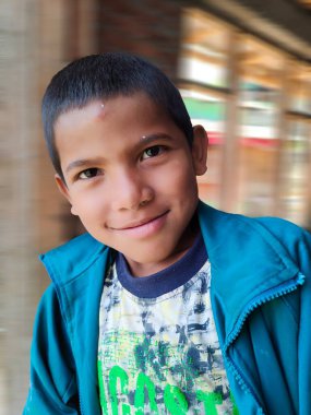 Himachal, India - June 6th, 2022 : Portrait of young Himalayan boy, kid in mountains