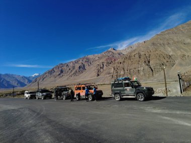 Ladakh, India - August 24th, 2022: SUV Car in Mountais, Road trip in Ladakh, Vehicle in Mountains of Himalayas.