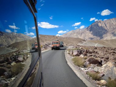 Ladakh, India - August 24th, 2022: SUV Car in Mountais, Road trip in Ladakh, Vehicle in Mountains of Himalayas.