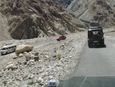 Ladakh, India - August 24th, 2022: SUV Car in Mountais, Road trip in Ladakh, Vehicle in Mountains of Himalayas.