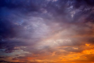 Beautiful bright multicolored sunset sky with yellow and pink hues, natural abstract background texture