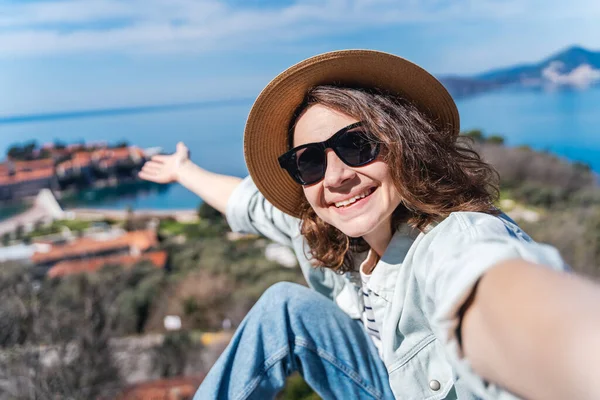 Happy Young Woman Hat Taking Photo Sveti Stefan Island Montenegro — Stock Photo, Image