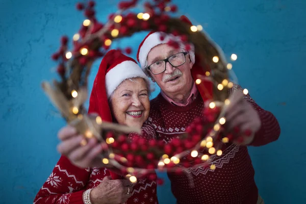 Portrait Happy Senior Couple Santa Claus Hats Studio Shoot Looking — Stock Photo, Image