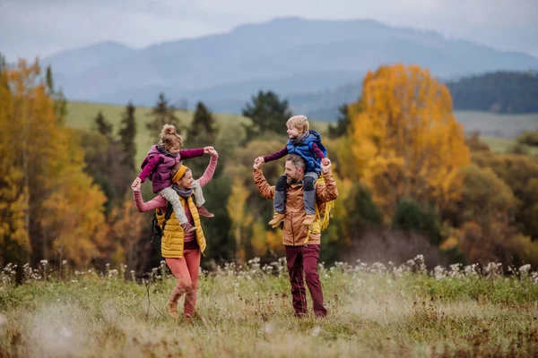 Happy Parents Little Kids Piggyback Autumn Walk Middle Colourfull Nature — Stock Photo, Image