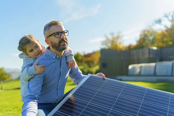 Father His Little Daughter Catching Sun Solar Panel Charging Backyard — Stock Photo, Image