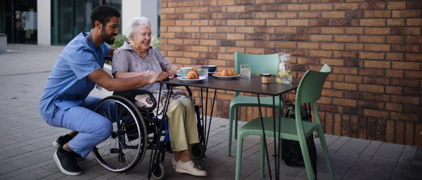 Caregiver Having Breakfast His Client Cafe — Stock Photo, Image