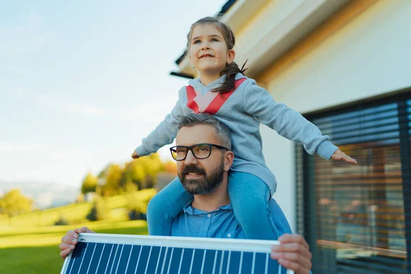 Father His Little Daughter Piggyback Catching Sun Solar Panel Charging — Stock Photo, Image