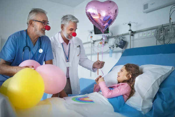 Happy Doctors Clown Red Noses Celebrating Birthday Little Girl Hospital — Stock Photo, Image