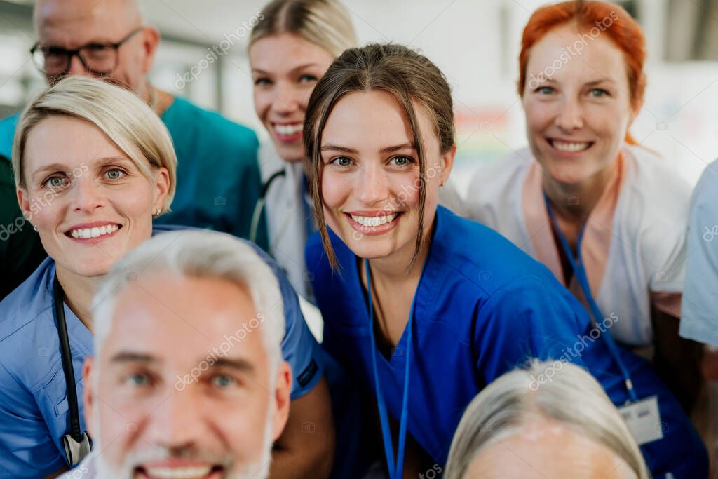Portrait of happy doctors, nurses and other medical staff in a hospital.